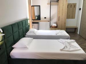 Posteľ alebo postele v izbe v ubytovaní Hotel Lido