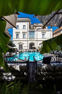 a swimming pool in front of a building at Palazzo Dama - Hotel & SPA - Preferred Hotels & Resorts in Rome