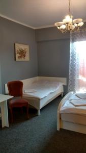 En eller flere senger på et rom på Zajazd Marco Torzym