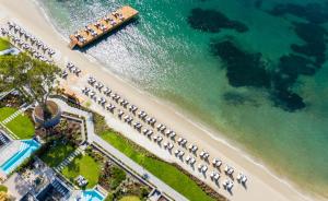 an aerial view of a beach with a row of hotels at Kaya Palazzo Resort & Residences Le Chic Bodrum in Bodrum City