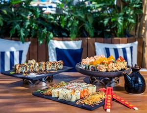 a table with two plates of food on it at Kaya Palazzo Resort & Residences Le Chic Bodrum in Bodrum City