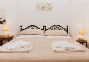 Giường trong phòng chung tại Poggio degli Ulivi