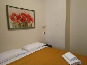 Łóżko lub łóżka w pokoju w obiekcie Hotel Everest