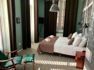 Postel nebo postele na pokoji v ubytování Hotel Nijver