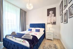 Posteľ alebo postele v izbe v ubytovaní Apartament CASA BIANCA