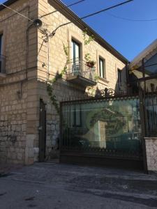 a building with a gate in front of it at Paradiso della Zagara in Ramacca