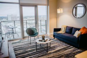 a living room with a couch and a table at Kasa The Gulch Nashville in Nashville