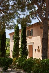 a large house with trees in front of it at Les Maisons Du Sud in Saint-Tropez