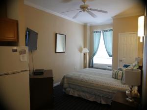 Postel nebo postele na pokoji v ubytování Athens Hotel & Suites