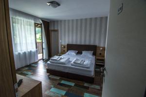 Postel nebo postele na pokoji v ubytování Veykata Resort & Spa + 12 fotografií