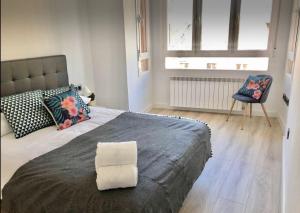 Llit o llits en una habitació de Apartamento Vive Zaragoza II
