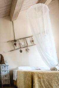 A bed or beds in a room at Colle Regnano