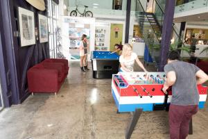 a man and woman playing a game on a wii at Railway Square YHA in Sydney