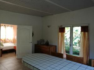 Postel nebo postele na pokoji v ubytování CASITA COLIBRIS