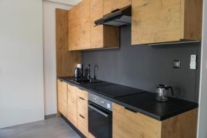 Kuchnia lub aneks kuchenny w obiekcie Apartamenty Dworcowa 45