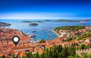 a view of a harbor with boats in the water at Rooms and Apartments Villa Town Gate Hvar in Hvar