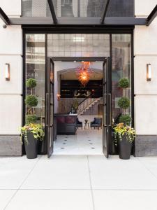 an open door into a building with potted plants at Broadway Plaza Hotel in New York