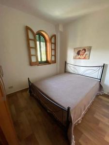 A bed or beds in a room at Casa Vacanza