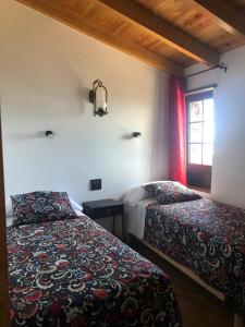 Ένα ή περισσότερα κρεβάτια σε δωμάτιο στο Casa La Tabona