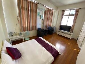 小城堡民宿Little Castle hotel 19窩窩近東大門夜市好停車房間的床