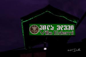 a neon sign for a ville edgemont restaurant at Villa Edemi in Tskaltubo