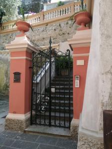 an entrance to a house with a black gate at La casa del girasole in Sestri Levante