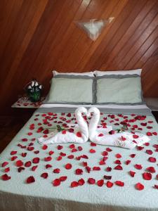 Cama ou camas em um quarto em Pousada Recanto das Águas