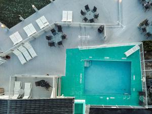 an overhead view of a building with a swimming pool at The BoatHouse in Marco Island