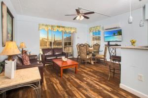 a living room with a couch and a table at The BoatHouse in Marco Island