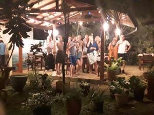 a group of people are standing under a tent at Karl Holiday Bungalow in Kalutara +90 photos