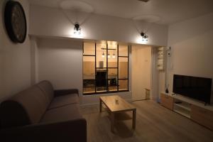 Зона вітальні в Cosy appartement Hyper centre ville avec cour + Patio