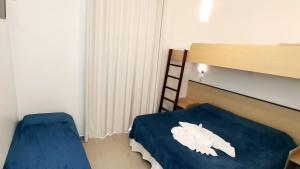 Ein Bett oder Betten in einem Zimmer der Unterkunft Pousada Omnimare