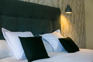 Łóżko lub łóżka w pokoju w obiekcie Hotel Spa Sinagoga