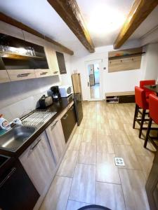 a kitchen with a sink and a counter top at Sauna Apartament in Braşov