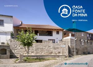 a building with a sign that reads csa centre dmg minima at Casa Fonte da Mina in Fund�o +3 photos