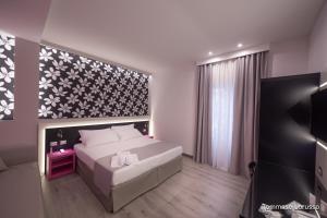 A bed or beds in a room at HOLYGOLD Suite ****
