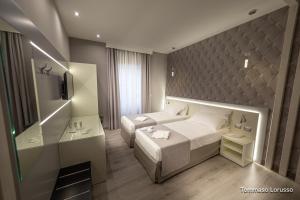A bed or beds in a room at HOLYGOLD Suite ****