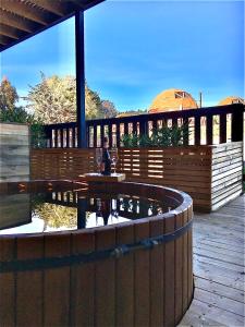 a wooden deck with a fountain on a patio at Pichilemu Domos in Pichilemu +67 photos
