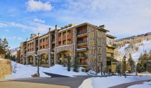 a large building with snow in front of it at The Landmark in Vail