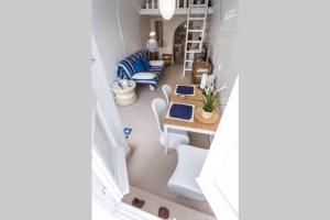 a view of a room with a table and chairs at Chalaris Armeni Villa in Oia