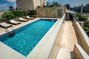 a swimming pool on top of a building at Hotel Grand Brizo Buenos Aires in Buenos Aires