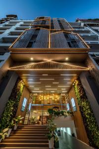 a building with stairs and plants in front of it at Icon Saigon - LifeStyle Design Hotel in Ho Chi Minh City