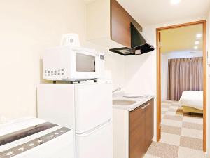 Una cocina o zona de cocina en HOTEL THE POINT Kiyomizu Gojo