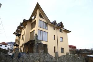 a large building with a pointed roof at Glanz in Yaremche