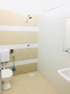 a bathroom with a toilet and a sink at Bismillah Homestay Muslem NETFLIX UNIFI HIGH SPEED in Kamunting +18 photos