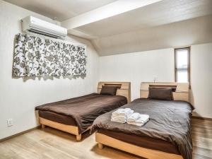 En eller flere senge i et værelse på Terrace Resort Chatan West
