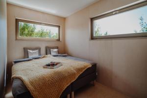 Postel nebo postele na pokoji v ubytování Šaldorfské domky