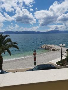 a view of a beach with a speed limit sign at Apartments Mare in Gradac