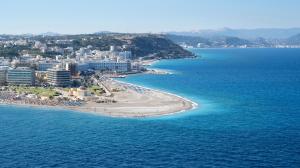 an aerial view of a beach and the ocean at Cactus Hotel in Rhodes Town