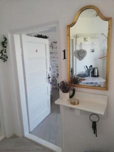 a bathroom with a white door and a mirror at House Albena in Durankulak +25 photos